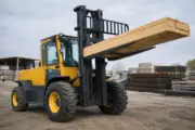 Rough-terrain forklift working on an outdoor industrial site